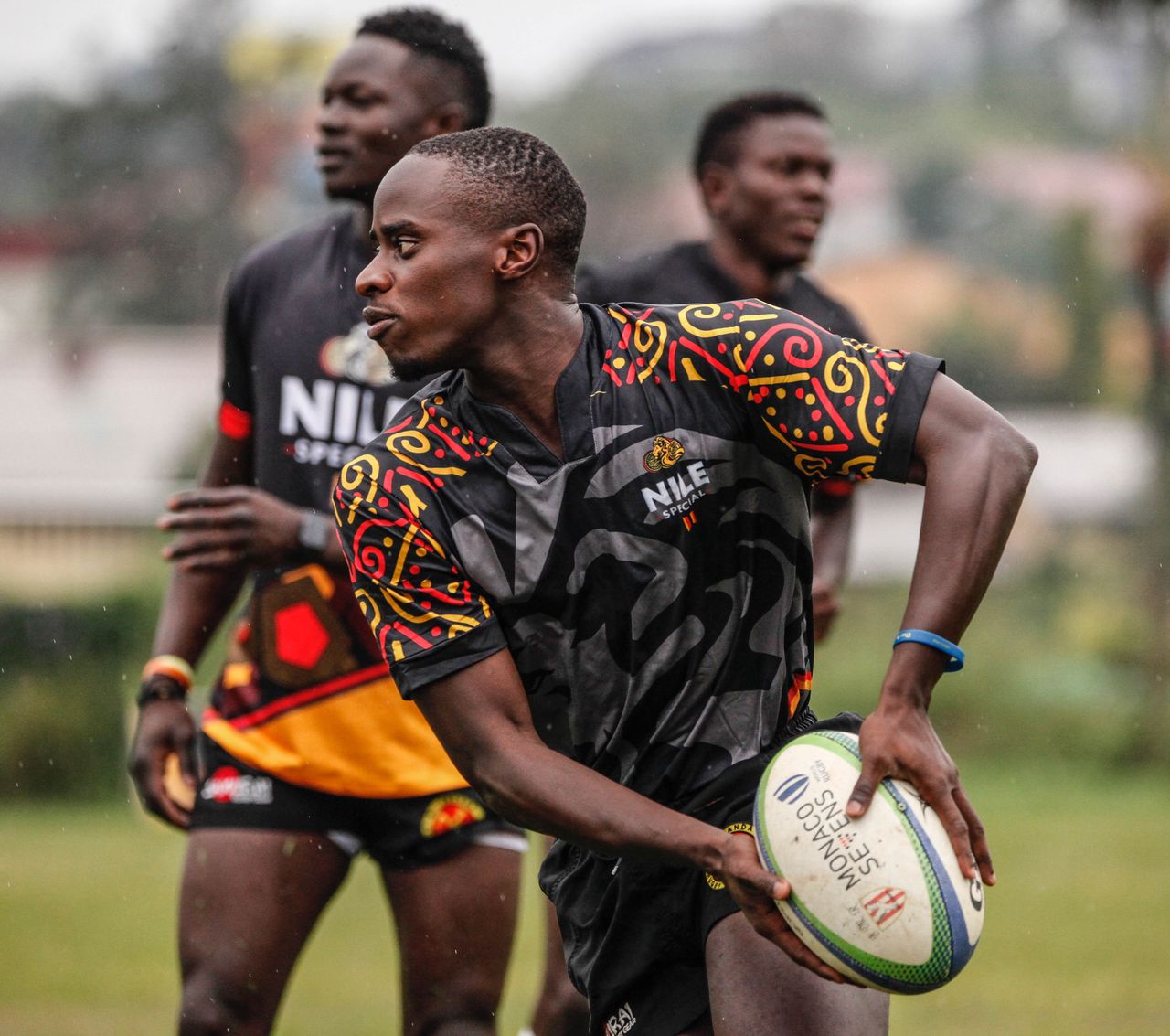 Intense rugby match with players in colorful jerseys capturing action and teamwork.