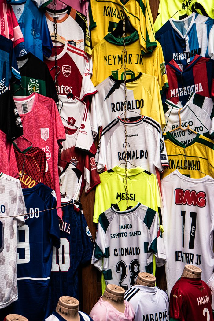 Vibrant display of legendary football jerseys from global icons, perfect for sports enthusiasts.